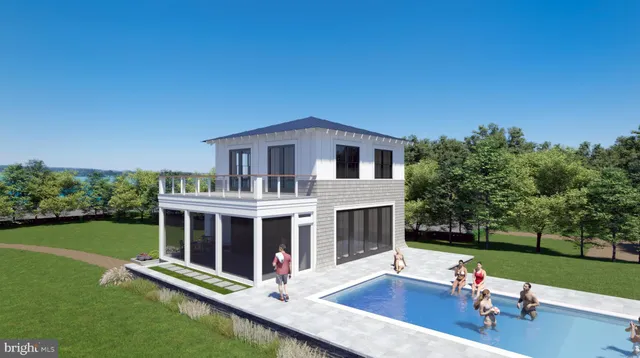 a front view of a house with garden and patio