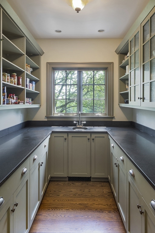 49 Willard Common Concord, MA 01742 - Photo 11 of 39 a kitchen with stainless steel appliances granite countertop a sink and a large window