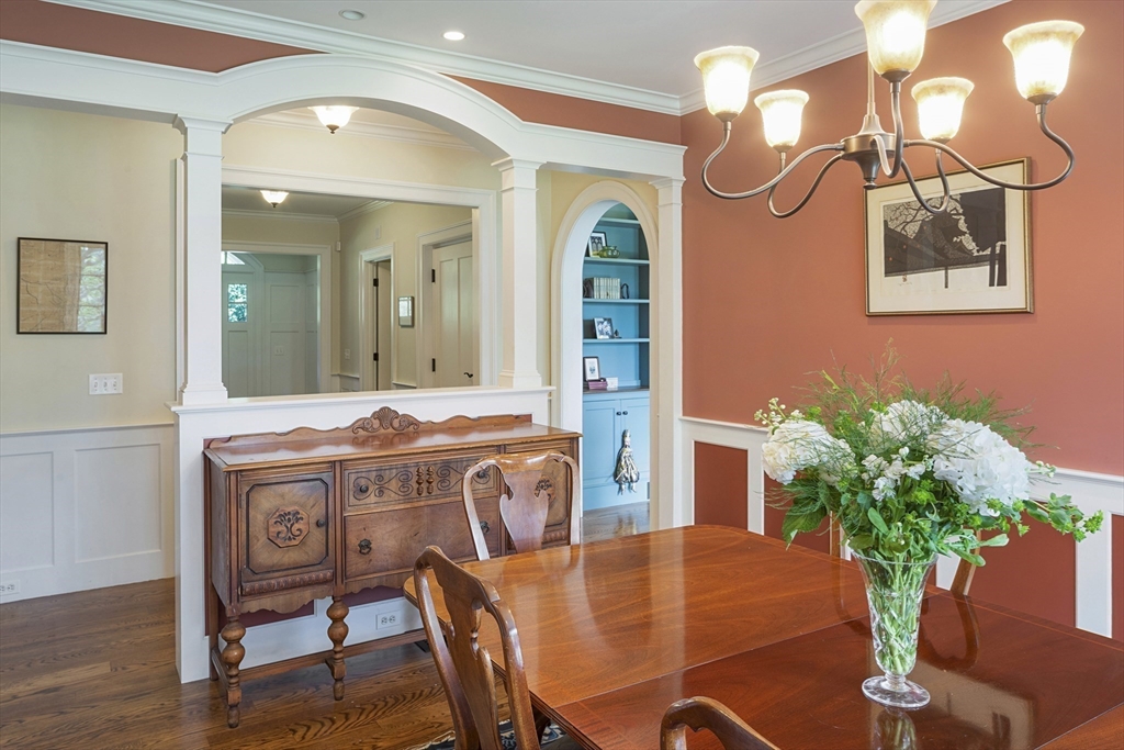 49 Willard Common Concord, MA 01742 - Photo 15 of 39 a view of a dining room with furniture and wooden floor