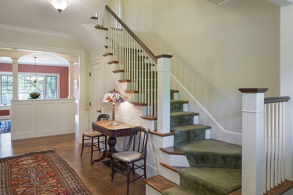 49 Willard Common Concord, MA 01742 - Photo 19 of 39 a view of entryway dining room and hall with wooden floor