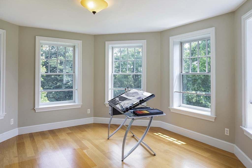 49 Willard Common Concord, MA 01742 - Photo 26 of 39 a living room with furniture and a window