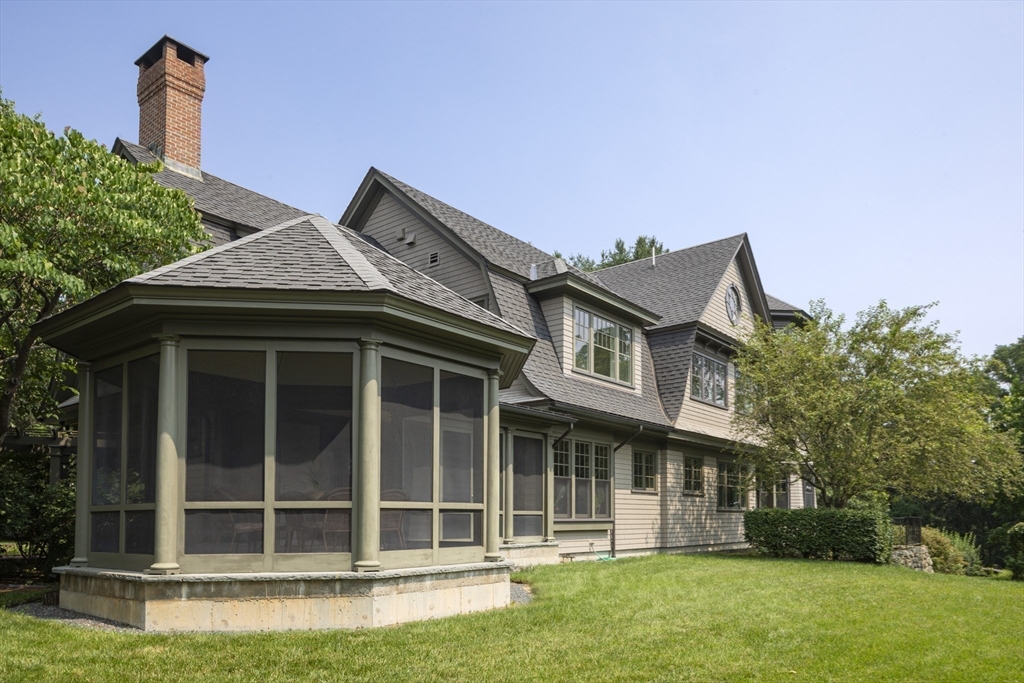 49 Willard Common Concord, MA 01742 - Photo 33 of 39 a front view of a house with a garden and yard
