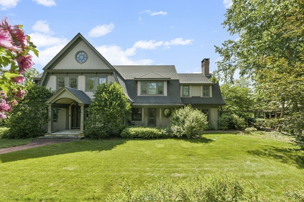 49 Willard Common Concord, MA 01742 - Photo 34 of 39 a front view of a house with a yard