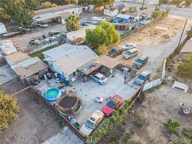 an aerial view of a house with outdoor space