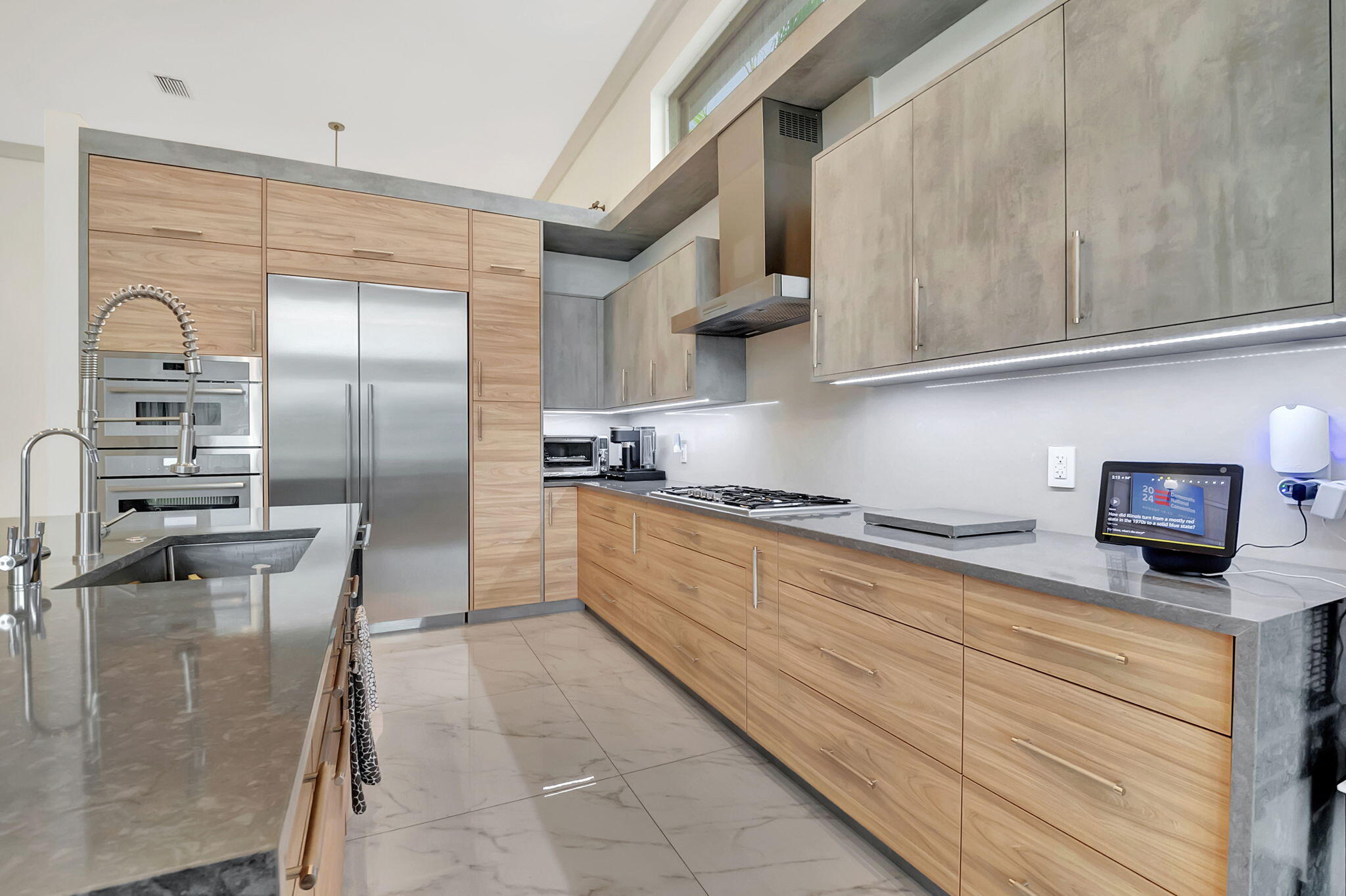 4137 Briarcliff Circle Boca Raton, FL 33496 - Photo 15 of 59 a kitchen with stainless steel appliances cabinets a sink and a counter top space