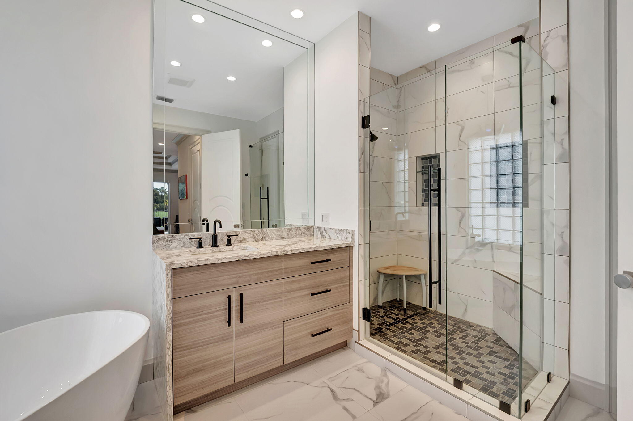 4137 Briarcliff Circle Boca Raton, FL 33496 - Photo 21 of 59 a bathroom with a granite countertop sink a toilet a mirror and shower