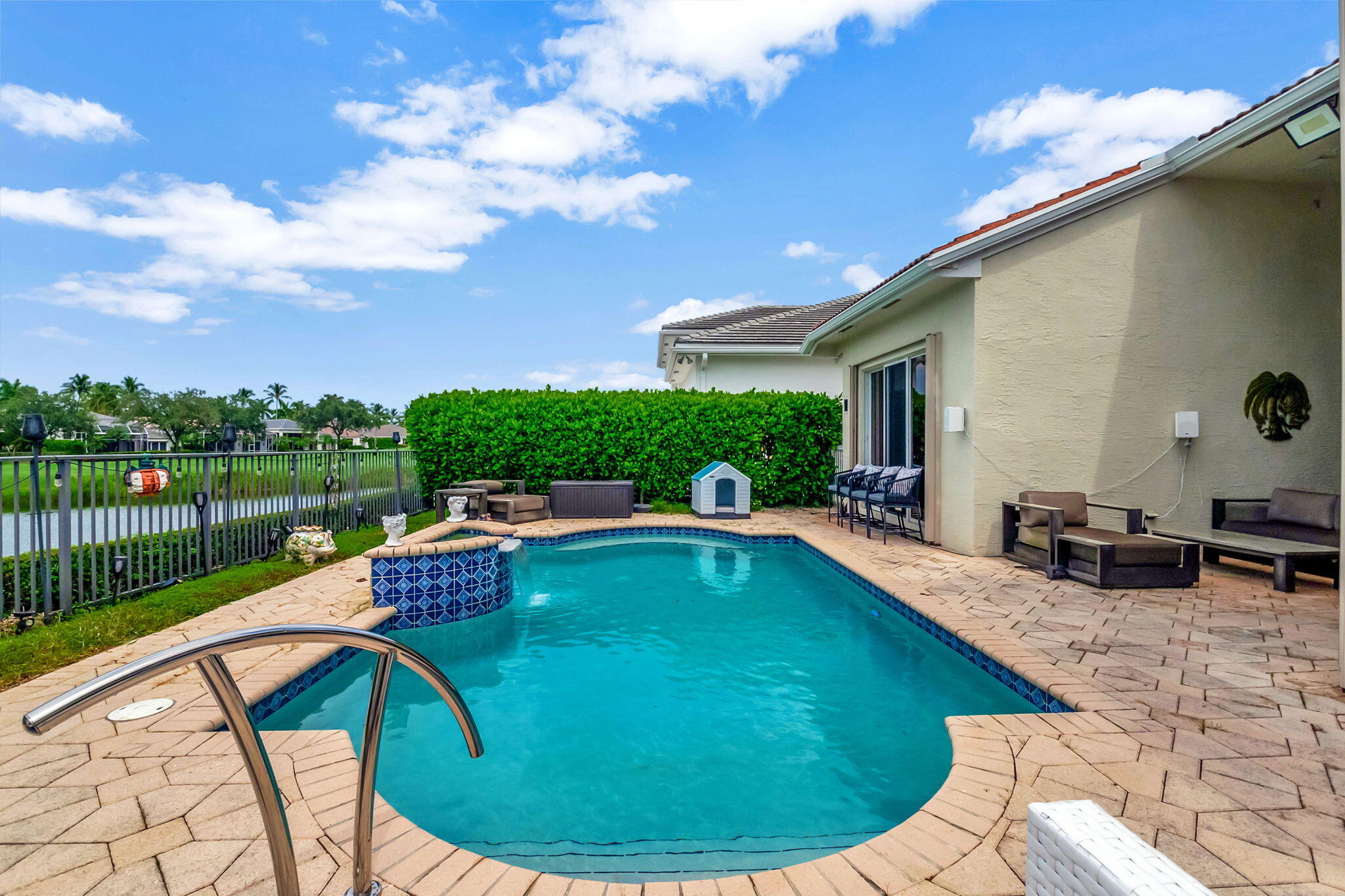 4137 Briarcliff Circle Boca Raton, FL 33496 - Photo 27 of 59 a view of a swimming pool with a patio