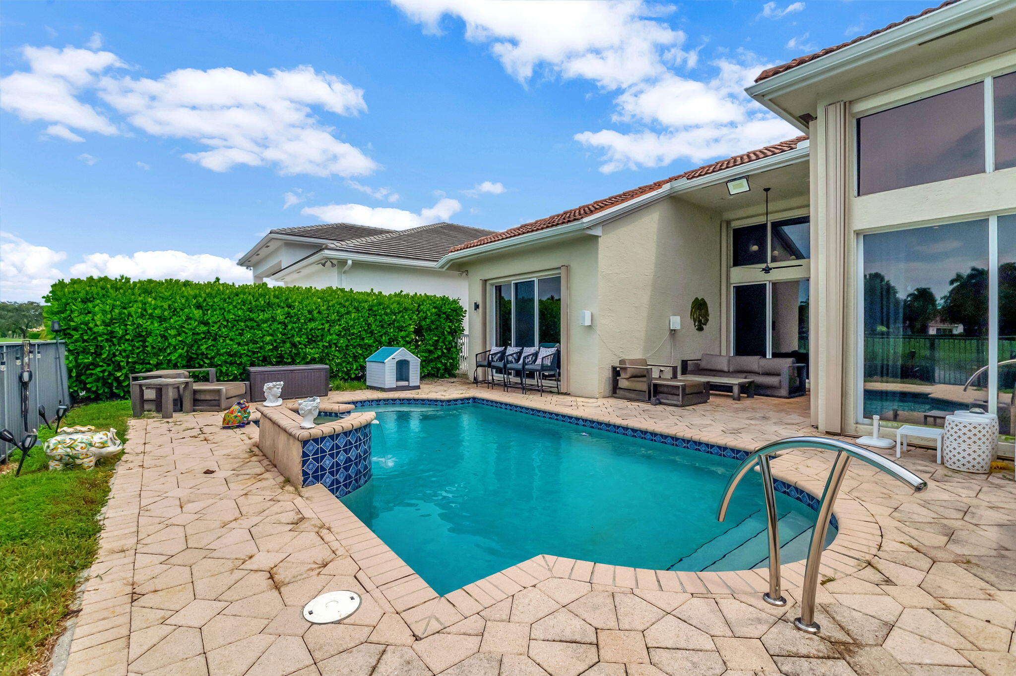 4137 Briarcliff Circle Boca Raton, FL 33496 - Photo 28 of 59 a view of a swimming pool and lounge chair