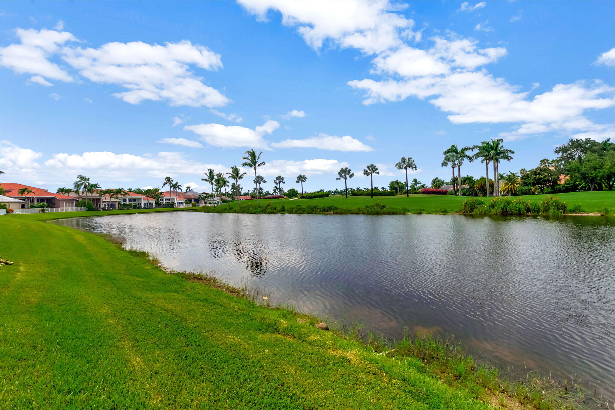 4137 Briarcliff Circle Boca Raton, FL 33496 - Photo 31 of 59 a view of a lake with houses in the back