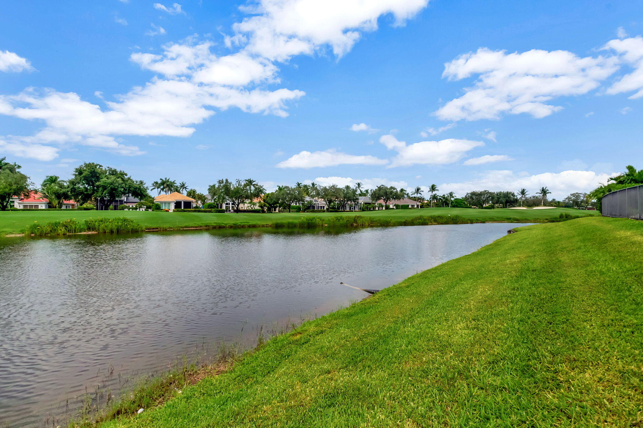 4137 Briarcliff Circle Boca Raton, FL 33496 - Photo 32 of 59 a view of a lake with a big yard