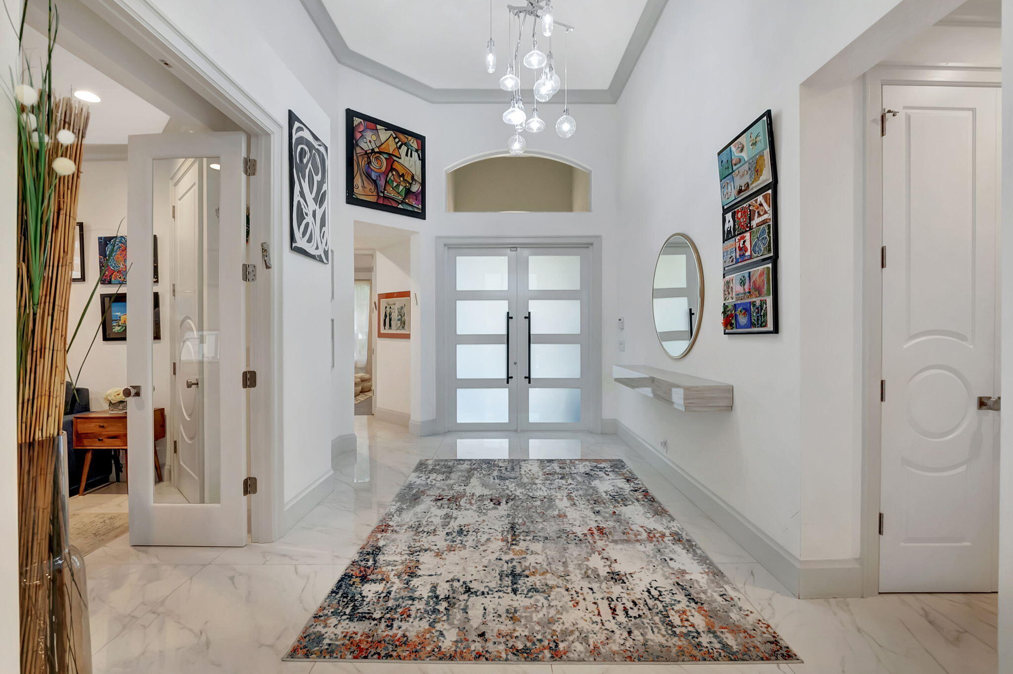 4137 Briarcliff Circle Boca Raton, FL 33496 - Photo 6 of 59 a view of a hallway view with living room and wooden floor