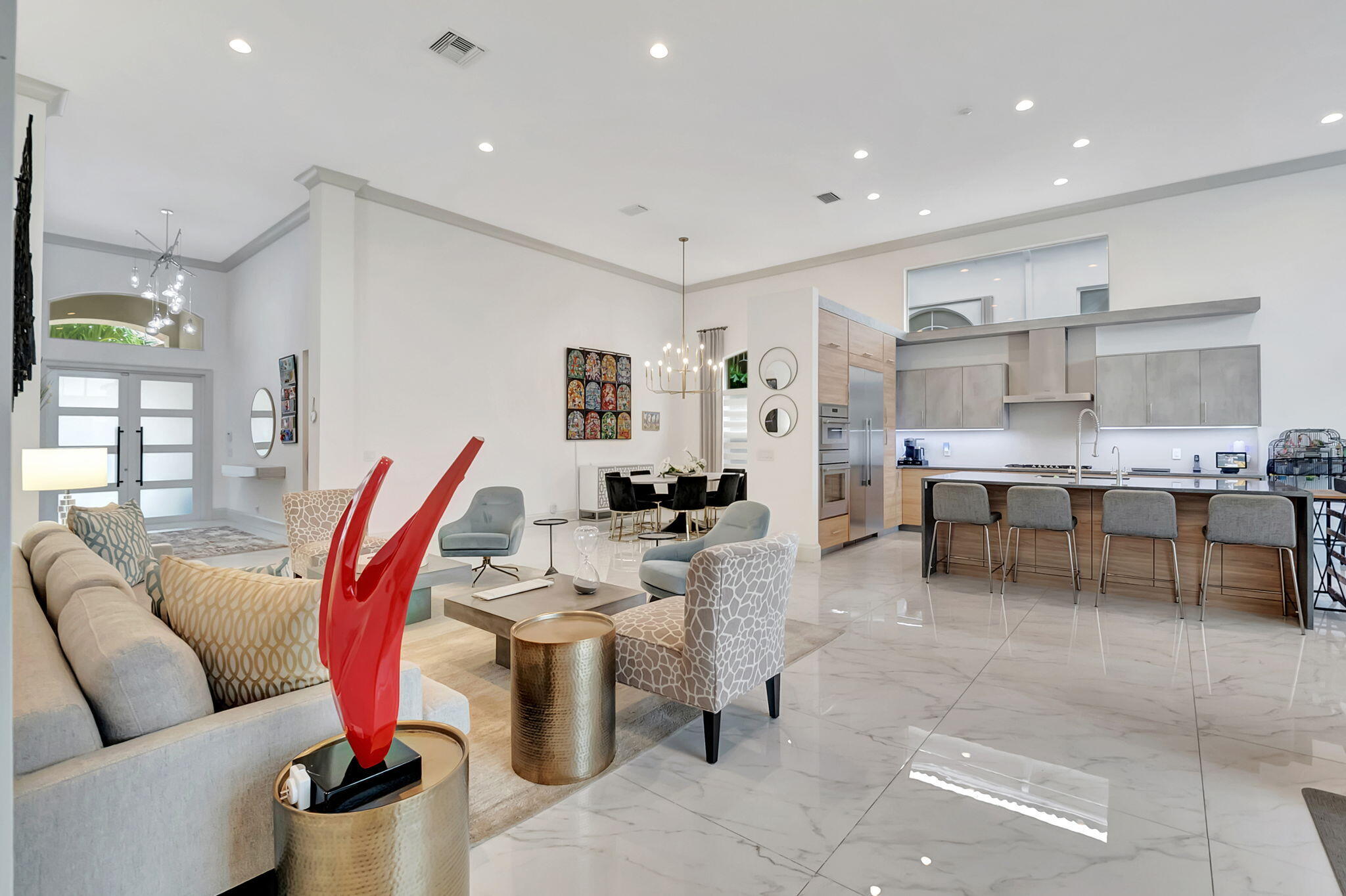 4137 Briarcliff Circle Boca Raton, FL 33496 - Photo 8 of 59 a living room with lots of furniture and kitchen view