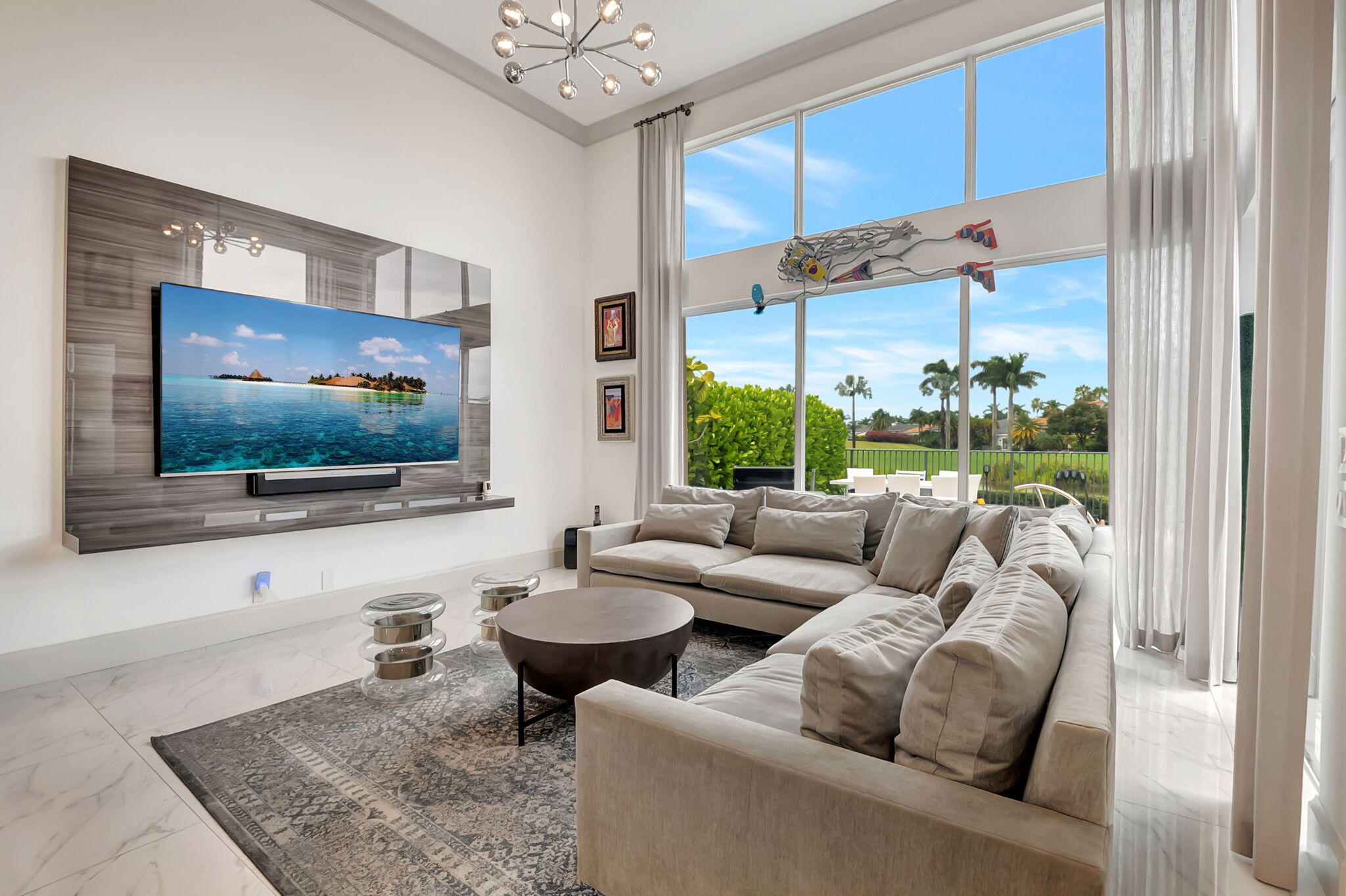 4137 Briarcliff Circle Boca Raton, FL 33496 - Photo 10 of 59 a living room with furniture and a flat screen tv