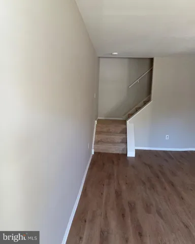 a view of an empty room with stairs