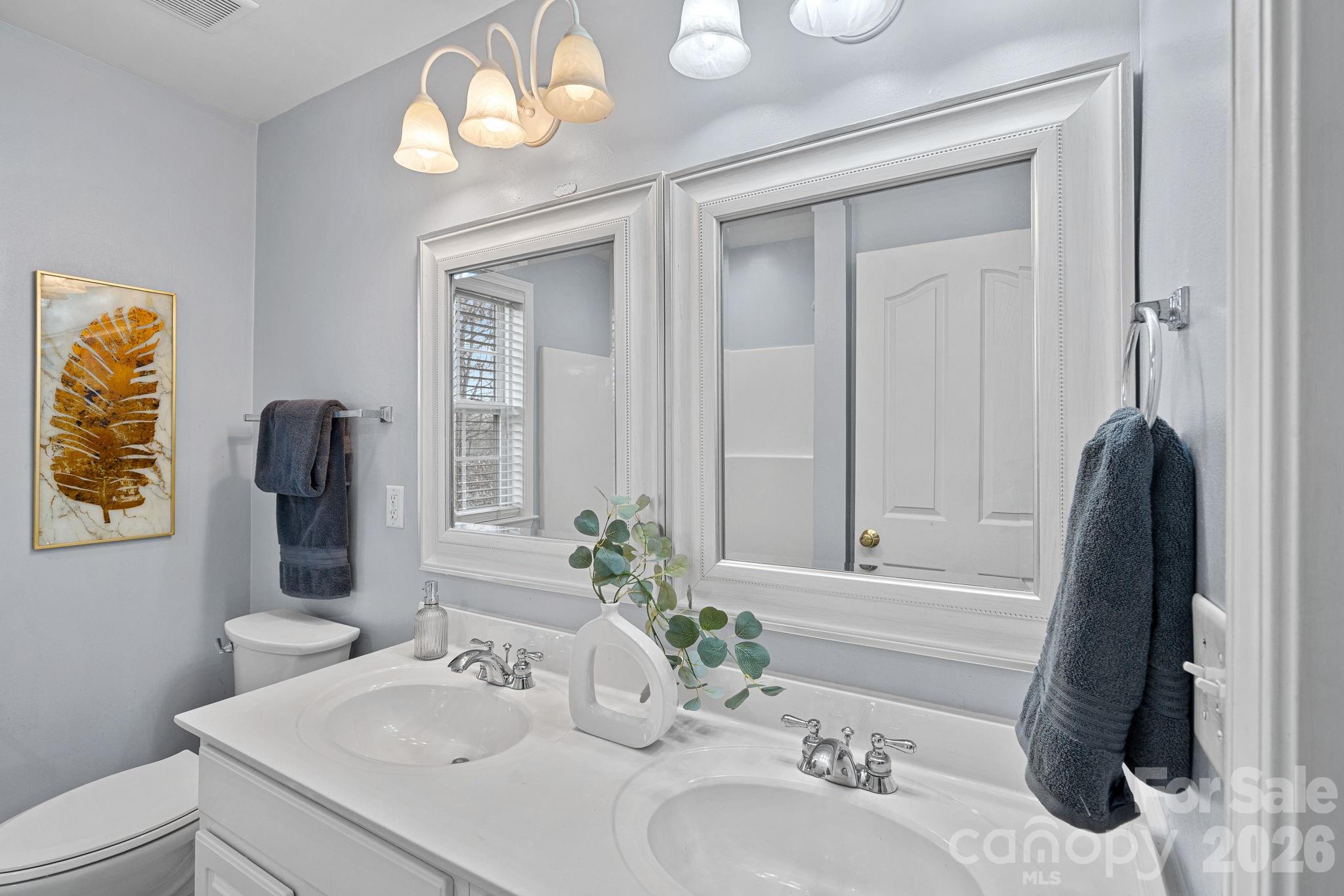 2017 East Foxwood Court Fort Mill, SC 29707 - Photo 18 of 33 a bathroom with a sink and a mirror
