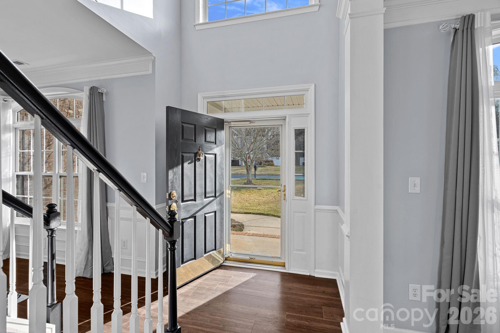 2017 East Foxwood Court Fort Mill, SC 29707 - Photo 2 of 33 a view of staircase with wooden floor and door