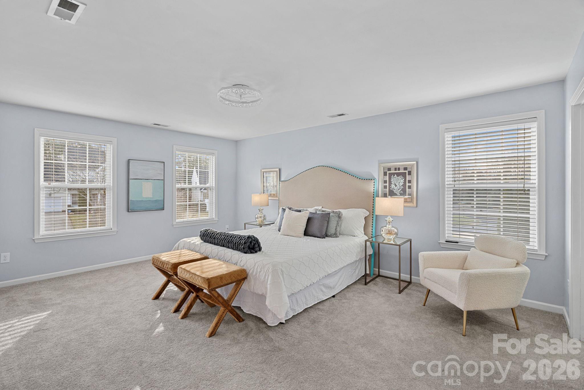 2017 East Foxwood Court Fort Mill, SC 29707 - Photo 22 of 33 a bed room with a bed and a chair