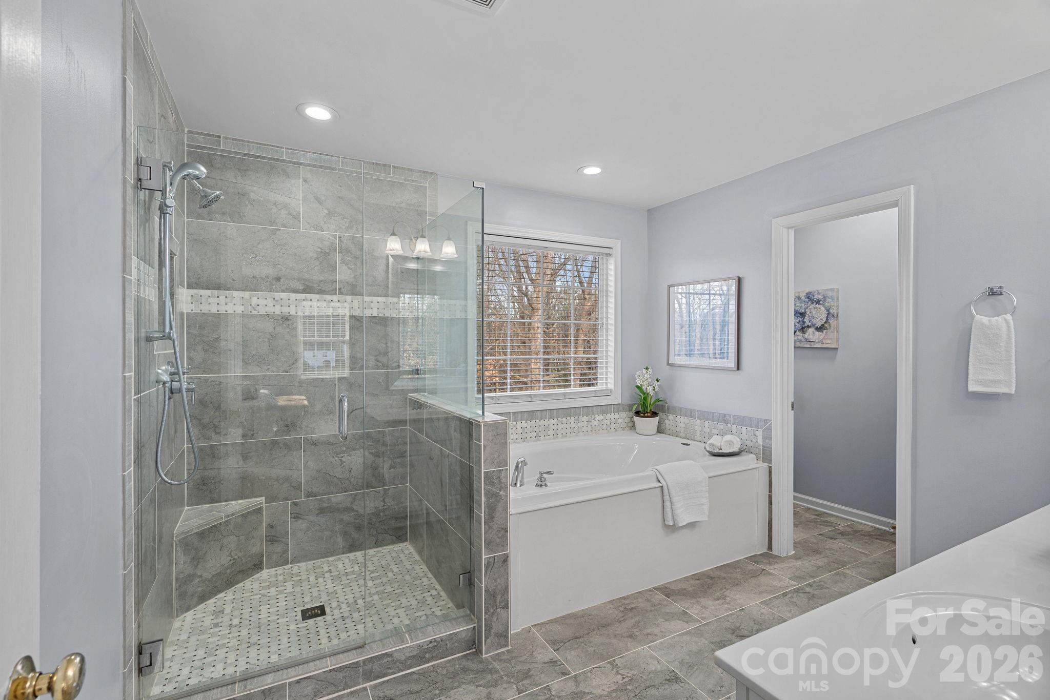 2017 East Foxwood Court Fort Mill, SC 29707 - Photo 24 of 33 a bathroom with a sink mirror and a shower