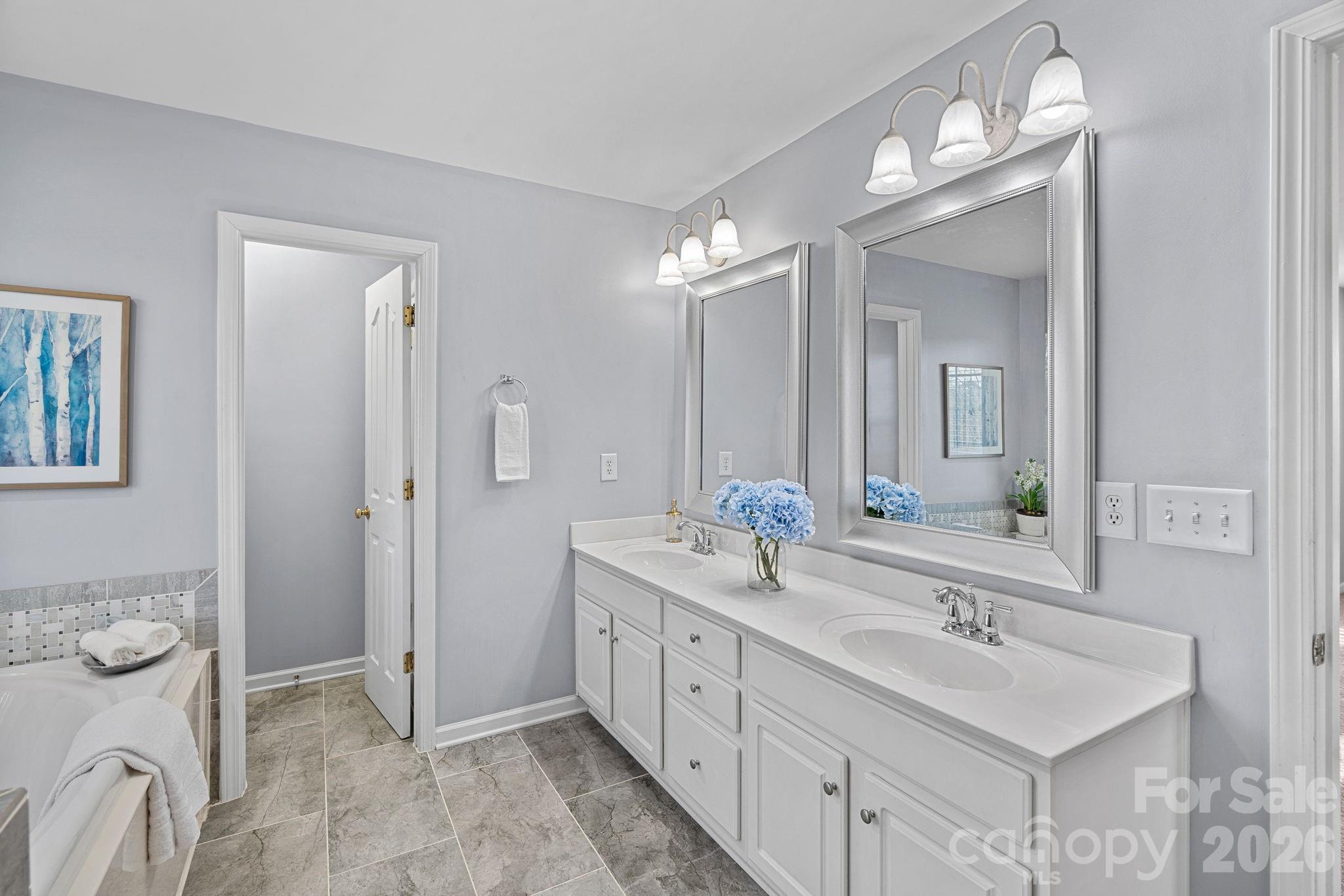 2017 East Foxwood Court Fort Mill, SC 29707 - Photo 25 of 33 a spacious bathroom with a double vanity sink mirror and double