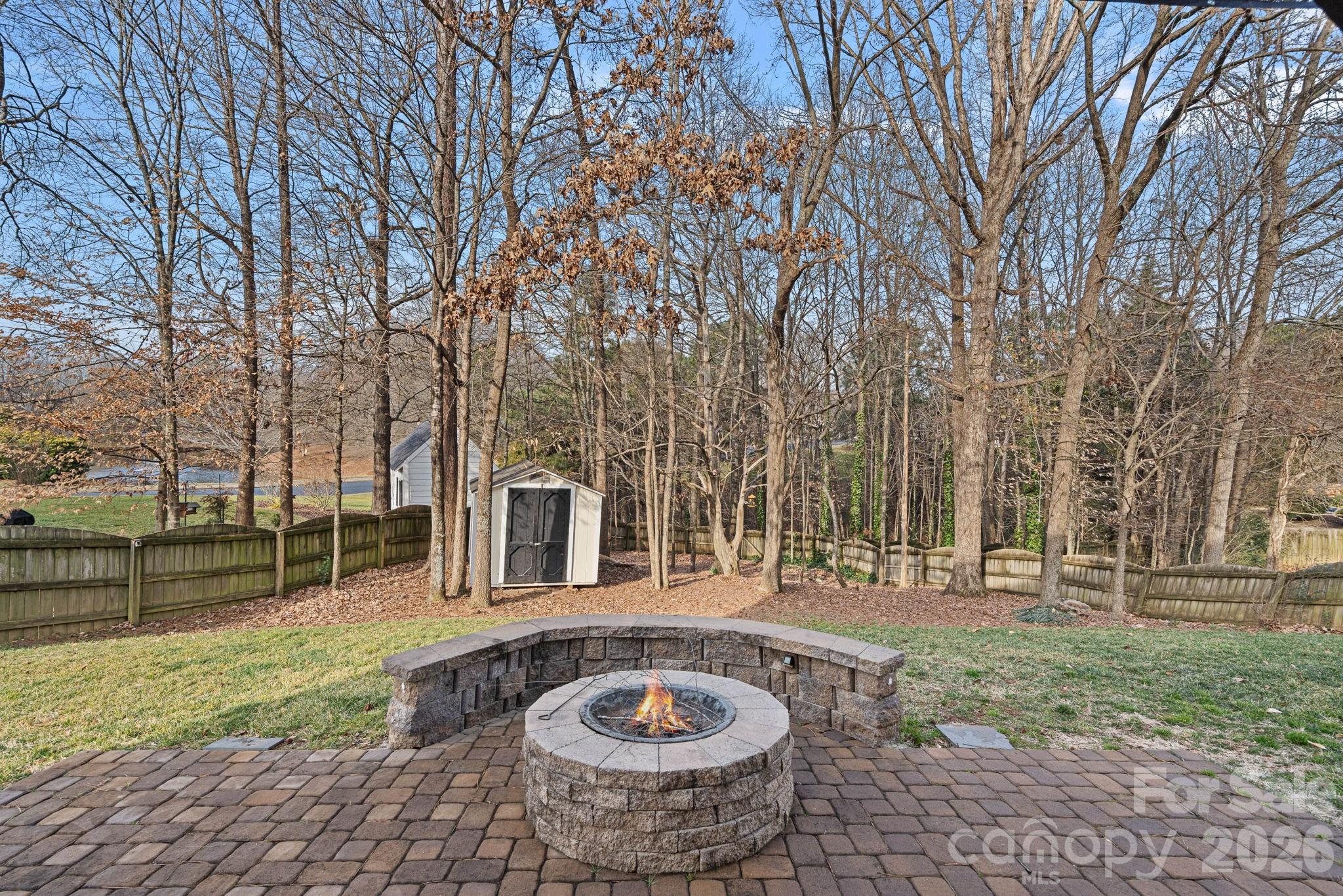 2017 East Foxwood Court Fort Mill, SC 29707 - Photo 28 of 33 a view of a house with backyard and trees