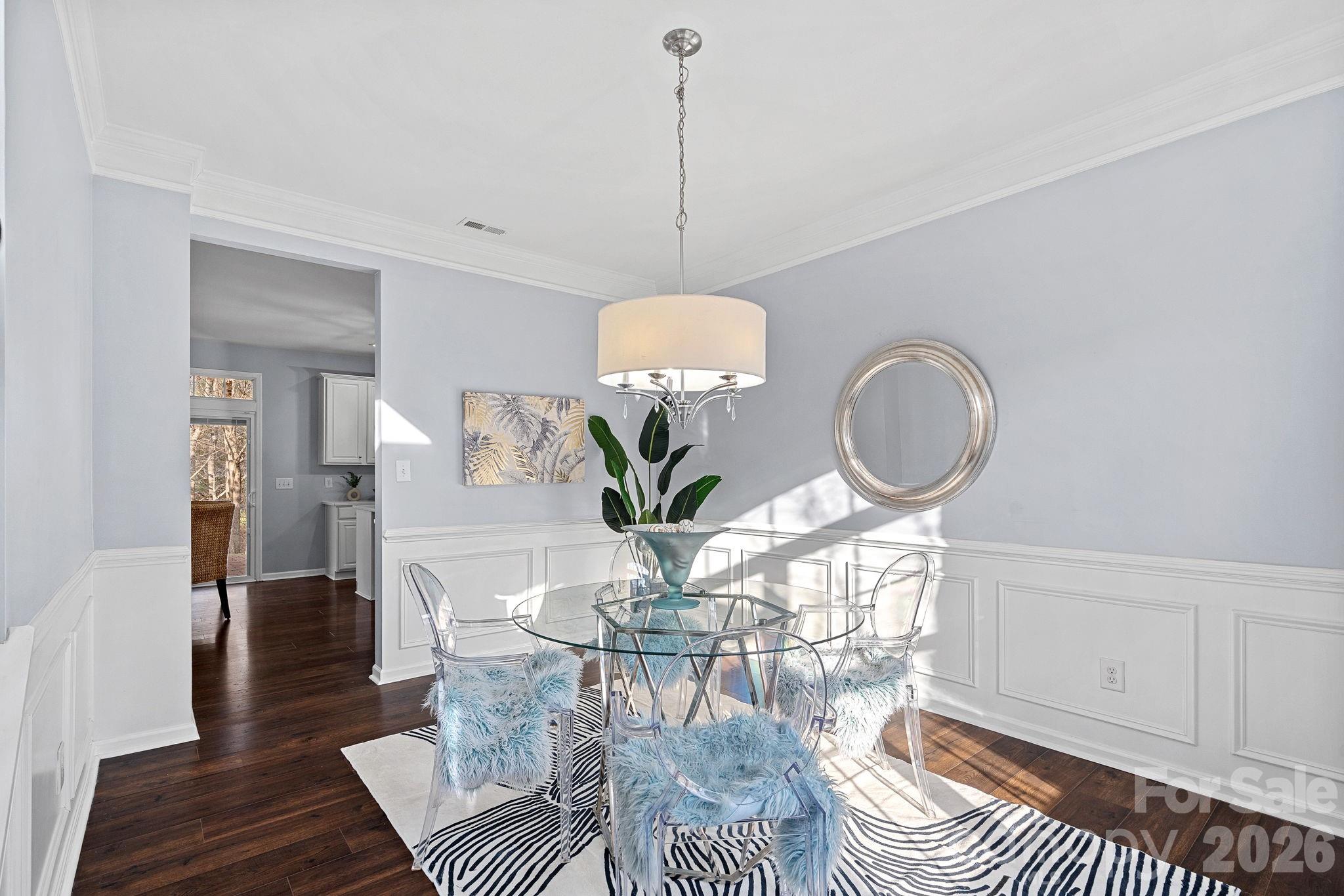2017 East Foxwood Court Fort Mill, SC 29707 - Photo 5 of 33 a view of a dining room with furniture wooden floor and chandelier