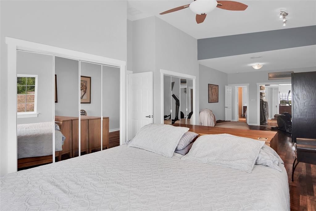 10616 Highway 78 Blue Ridge, TX 75424 - Photo 17 of 28 a bedroom with a bed and dresser with mirror