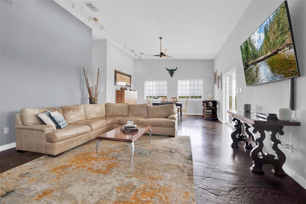 10616 Highway 78 Blue Ridge, TX 75424 - Photo 5 of 28 a living room with furniture wooden floor and a large window