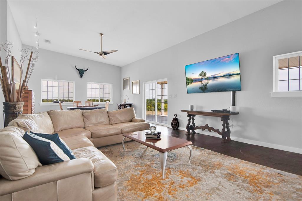 10616 Highway 78 Blue Ridge, TX 75424 - Photo 6 of 28 a living room with furniture a large window and a flat screen tv