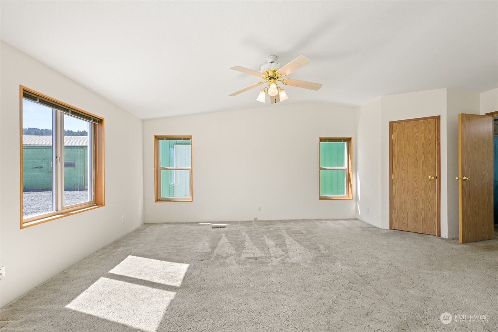 3323 East Smith Road Bellingham, WA 98226 - Photo 14 of 34 an empty room with windows and fan