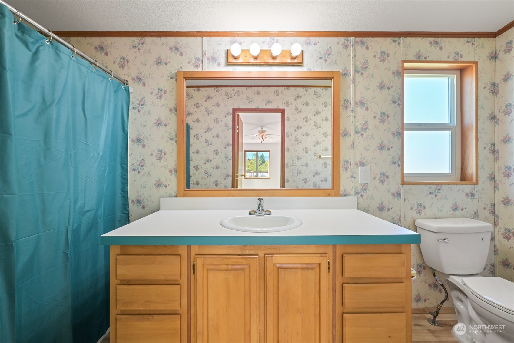 3323 East Smith Road Bellingham, WA 98226 - Photo 17 of 34 a bathroom with a granite countertop sink and a mirror