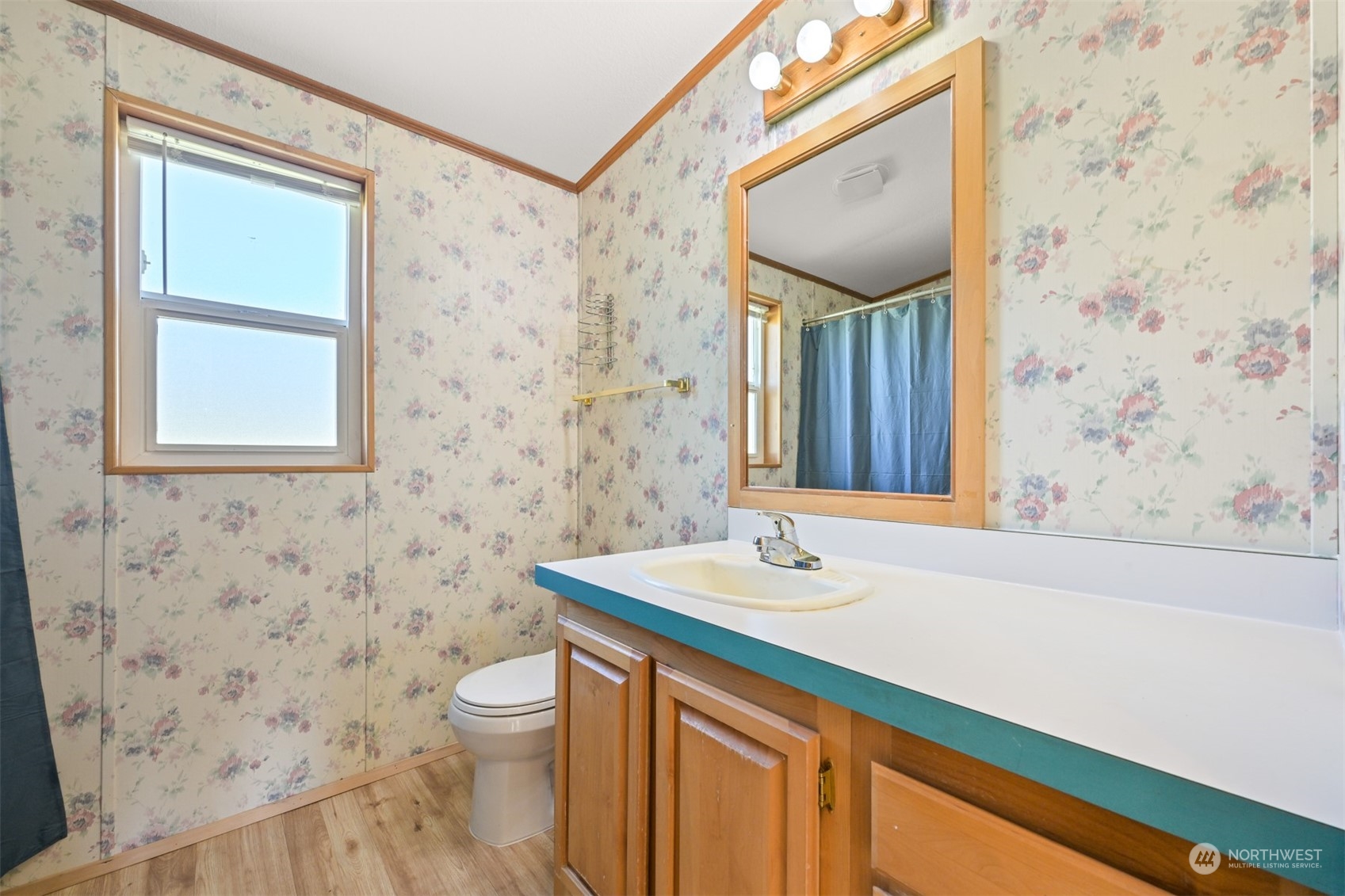 3323 East Smith Road Bellingham, WA 98226 - Photo 19 of 34 a bathroom with a granite countertop sink toilet and mirror