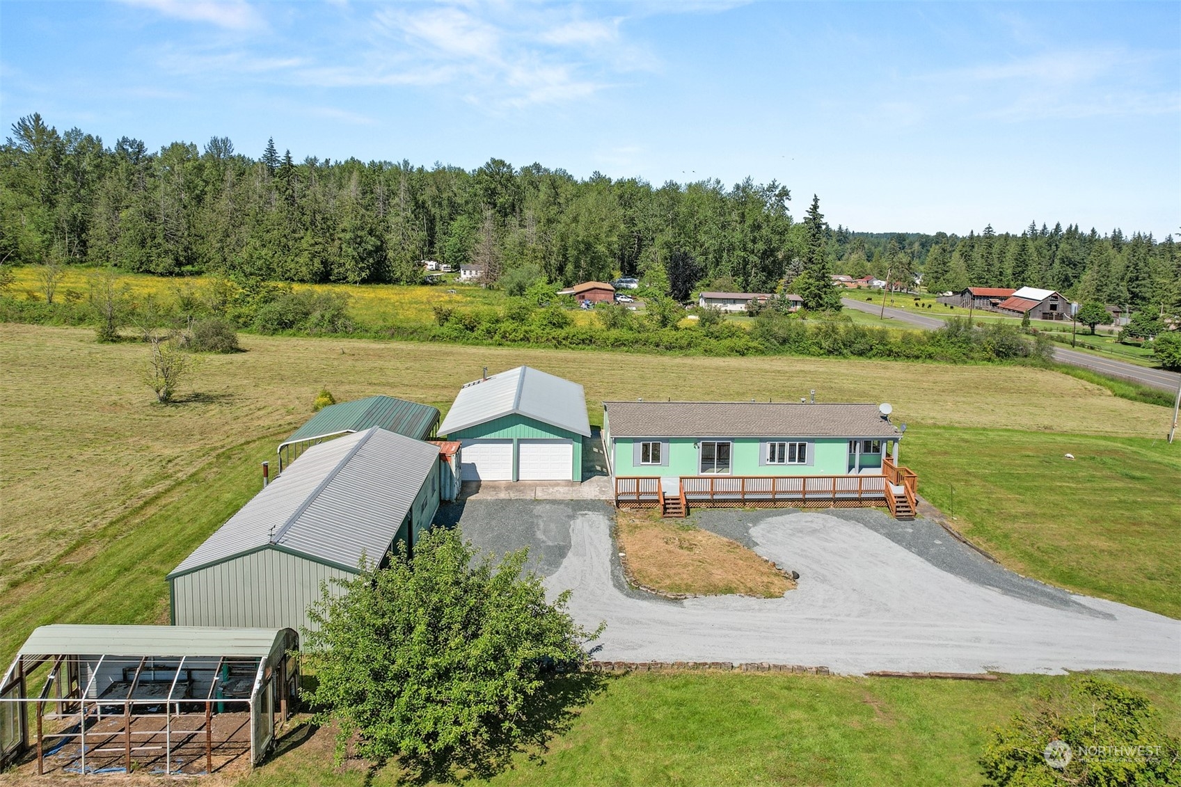 3323 East Smith Road Bellingham, WA 98226 - Photo 32 of 34 a view of a lake with a yard and large trees