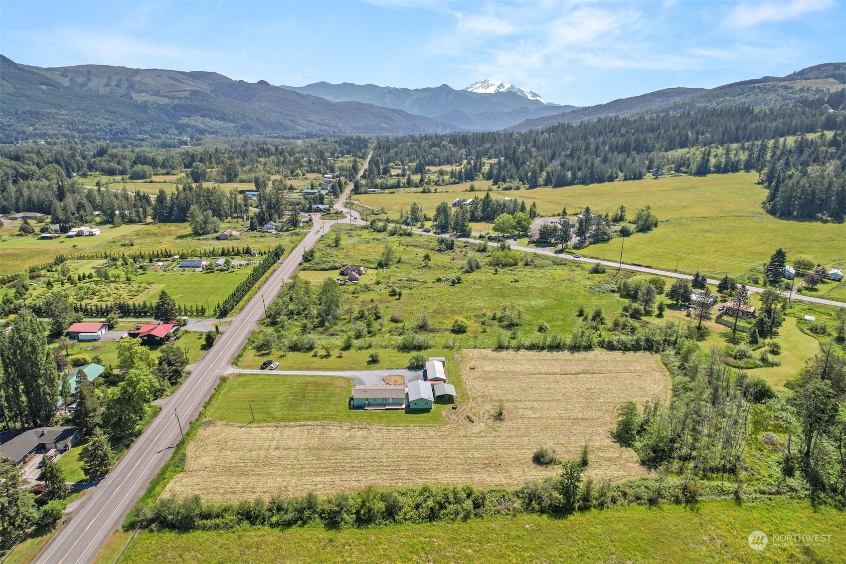 3323 East Smith Road Bellingham, WA 98226 - Photo 34 of 34 a view of a lush green hillside and houses