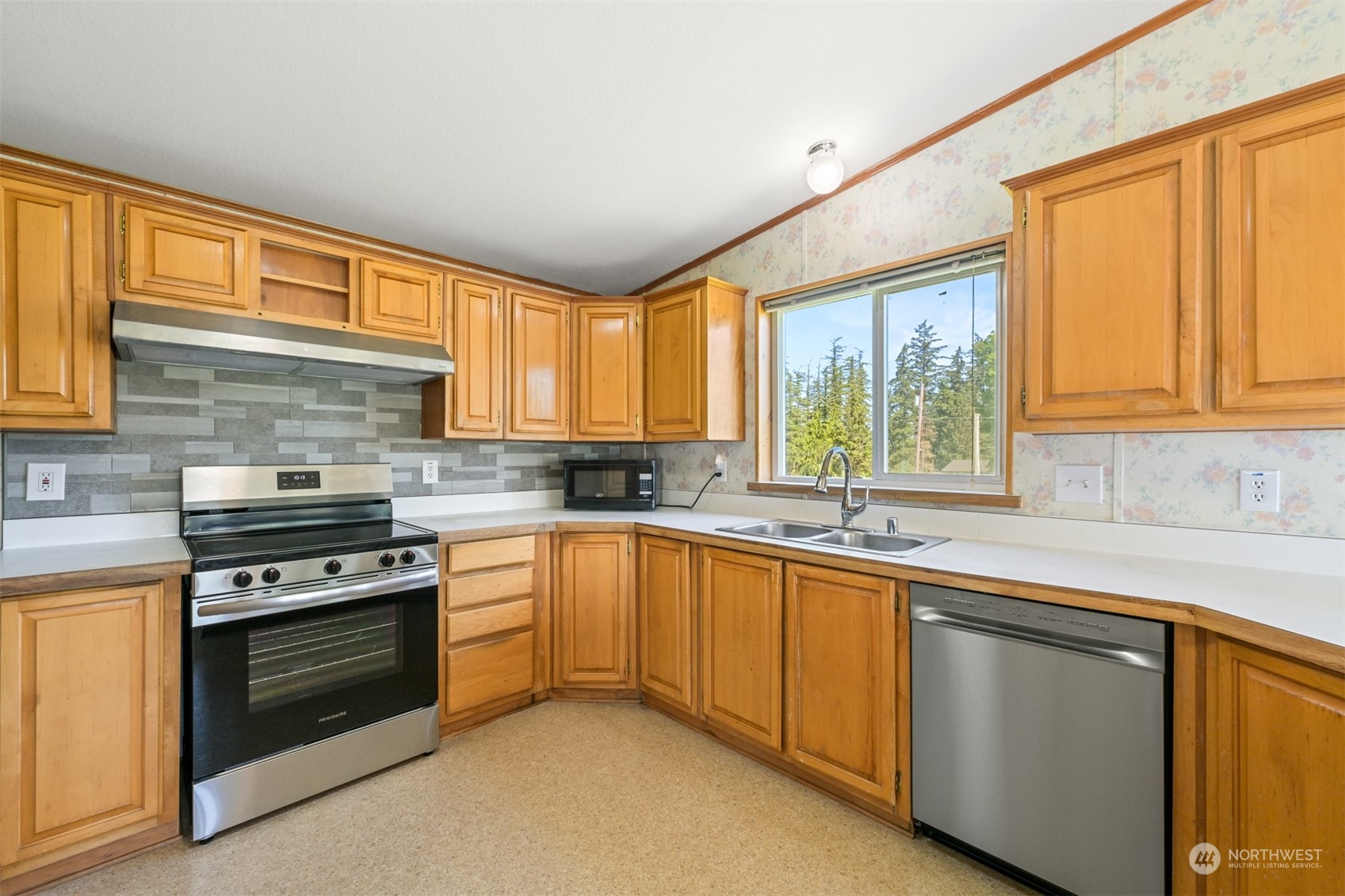 3323 East Smith Road Bellingham, WA 98226 - Photo 10 of 34 a kitchen with a sink stove and cabinets