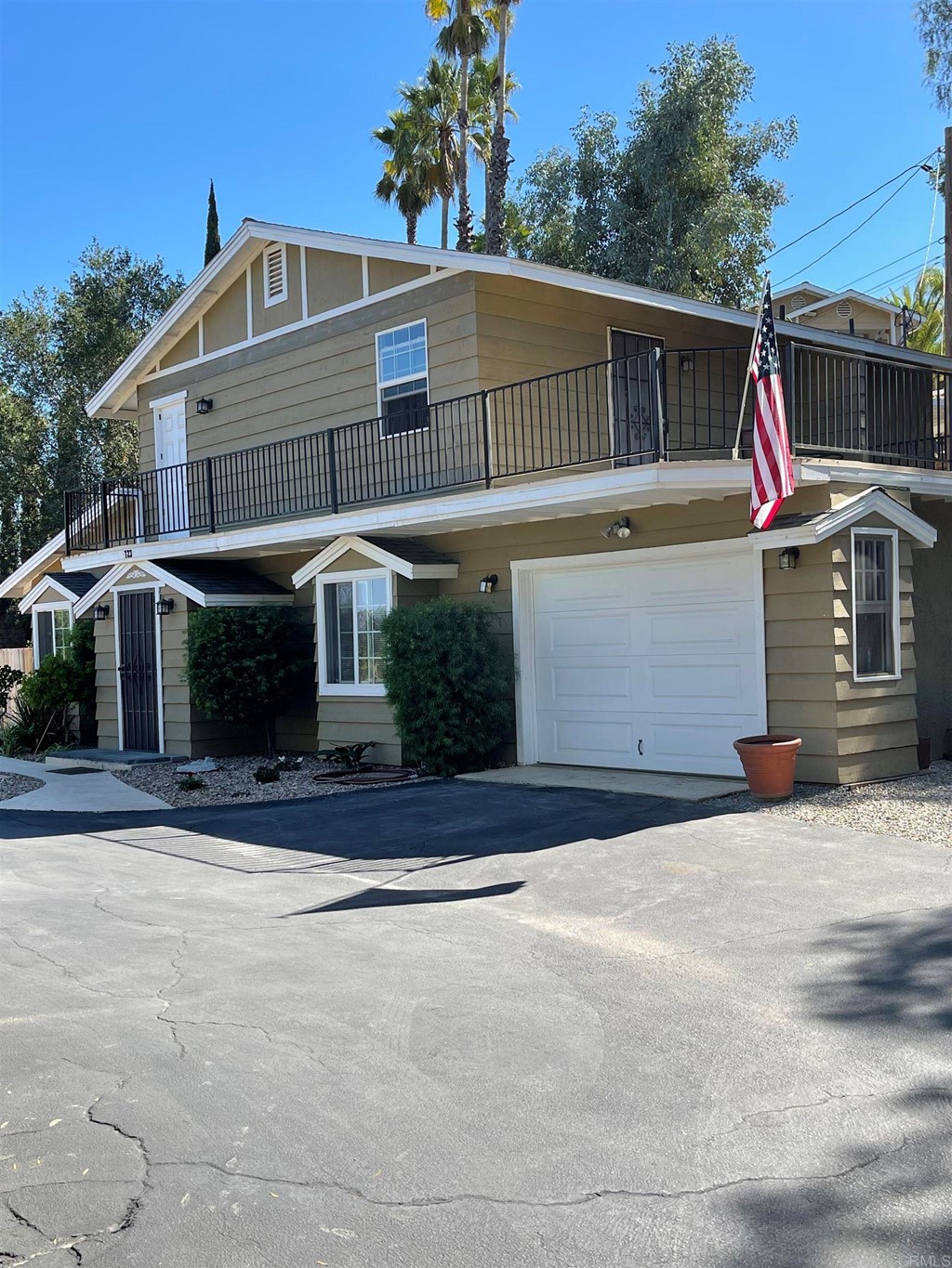 a front view of a house with a garage