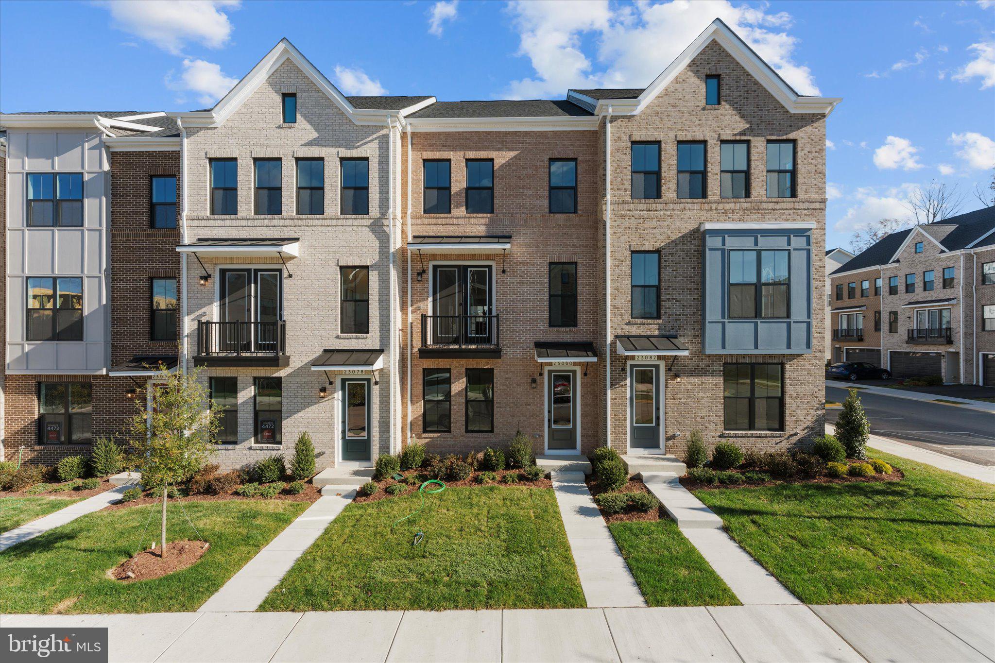 23080 Soaring Hts Terrace Ashburn, VA 20148 - Photo 1 of 44 front view of a house with a yard