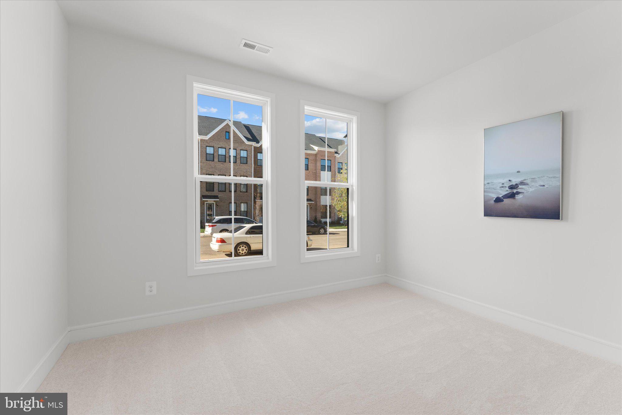 23080 Soaring Hts Terrace Ashburn, VA 20148 - Photo 14 of 44 an empty room with windows