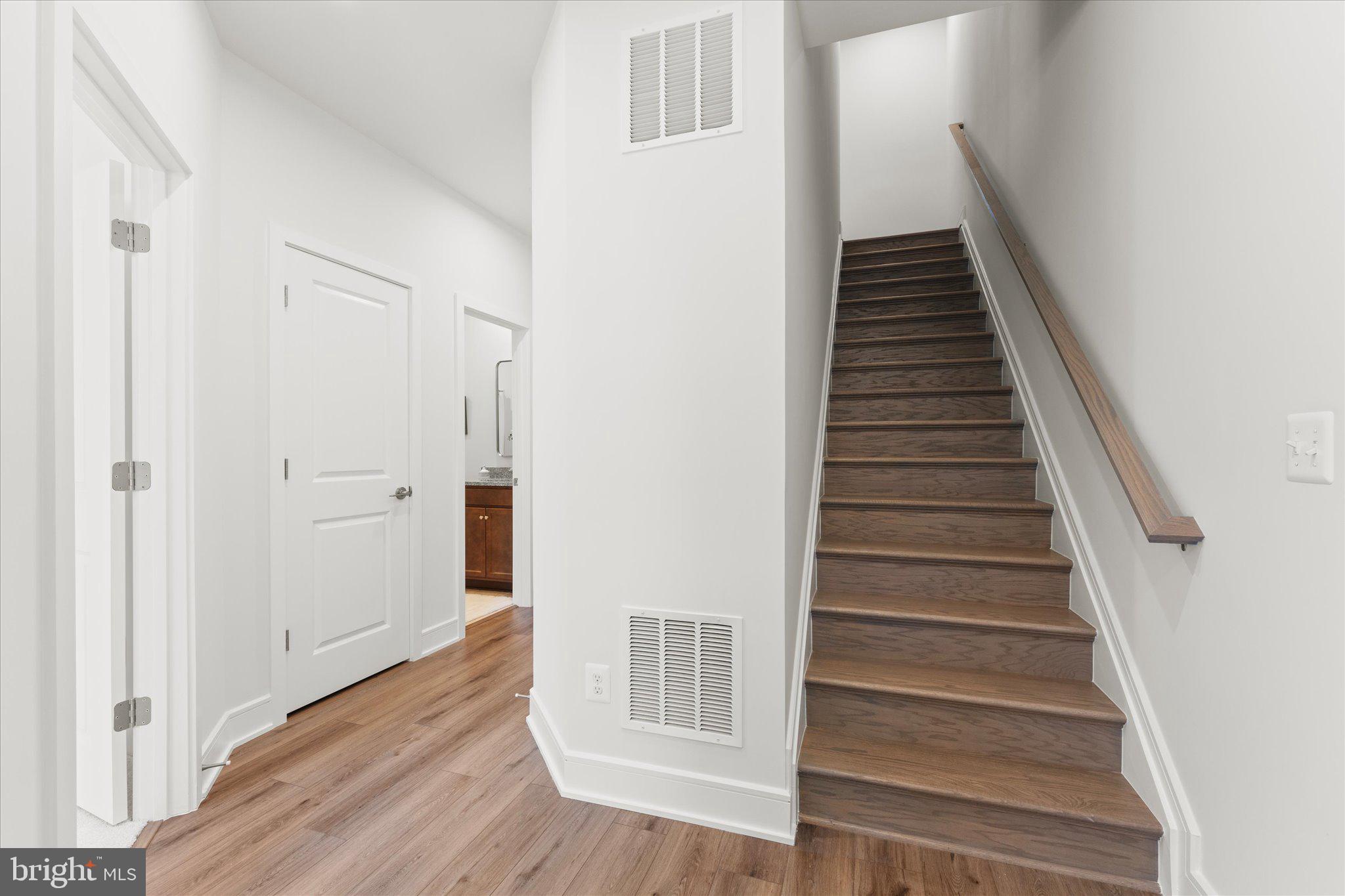 23080 Soaring Hts Terrace Ashburn, VA 20148 - Photo 18 of 44 a view of an entryway with wooden floor