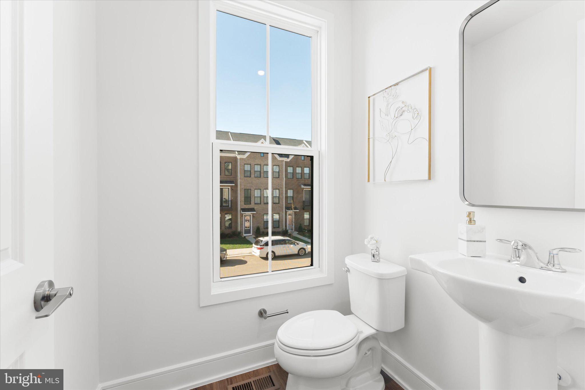 23080 Soaring Hts Terrace Ashburn, VA 20148 - Photo 21 of 44 a bathroom with a sink toilet and shower