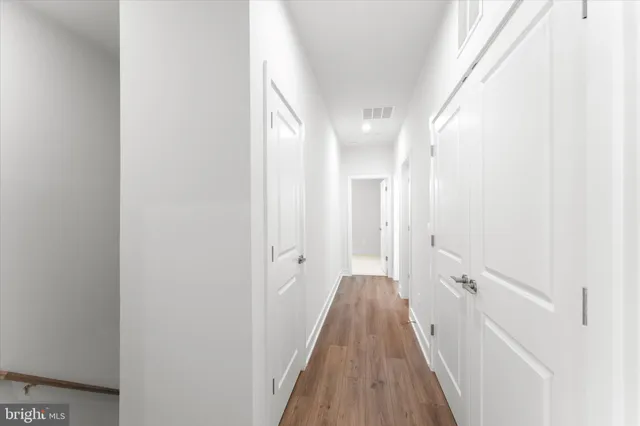 a view of a bathroom from the hallway