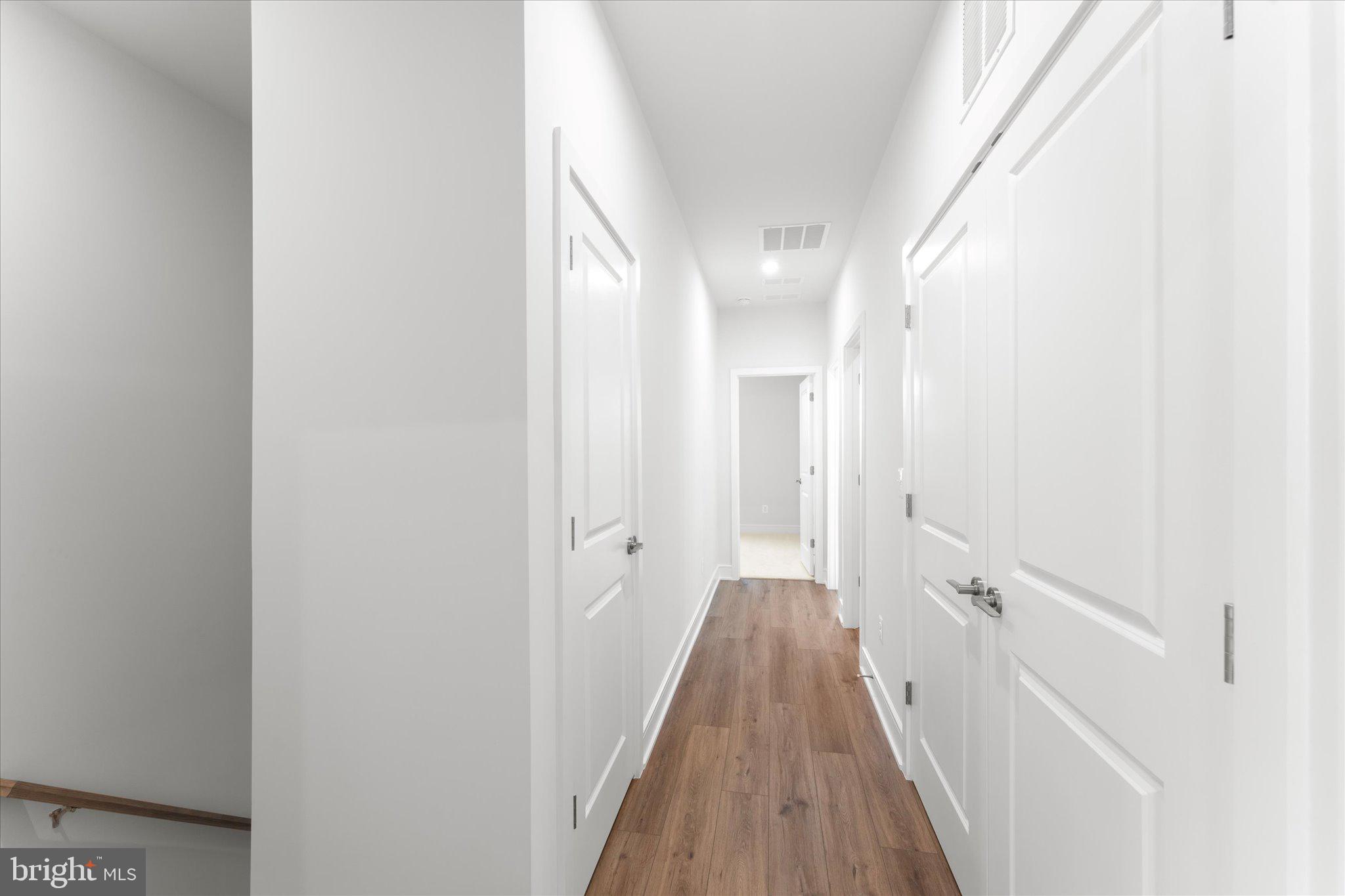 23080 Soaring Hts Terrace Ashburn, VA 20148 - Photo 22 of 44 a view of a bathroom from the hallway