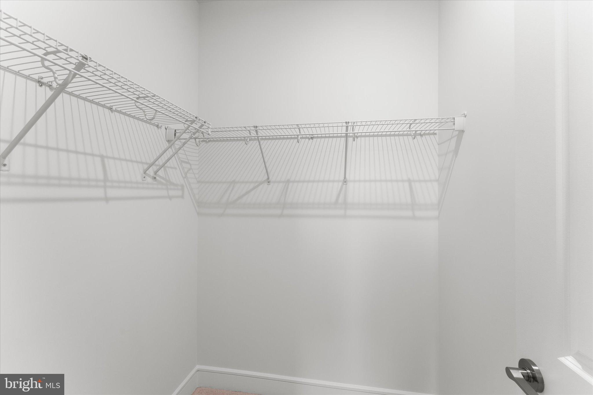 23080 Soaring Hts Terrace Ashburn, VA 20148 - Photo 33 of 44 a view of a rack on the wall