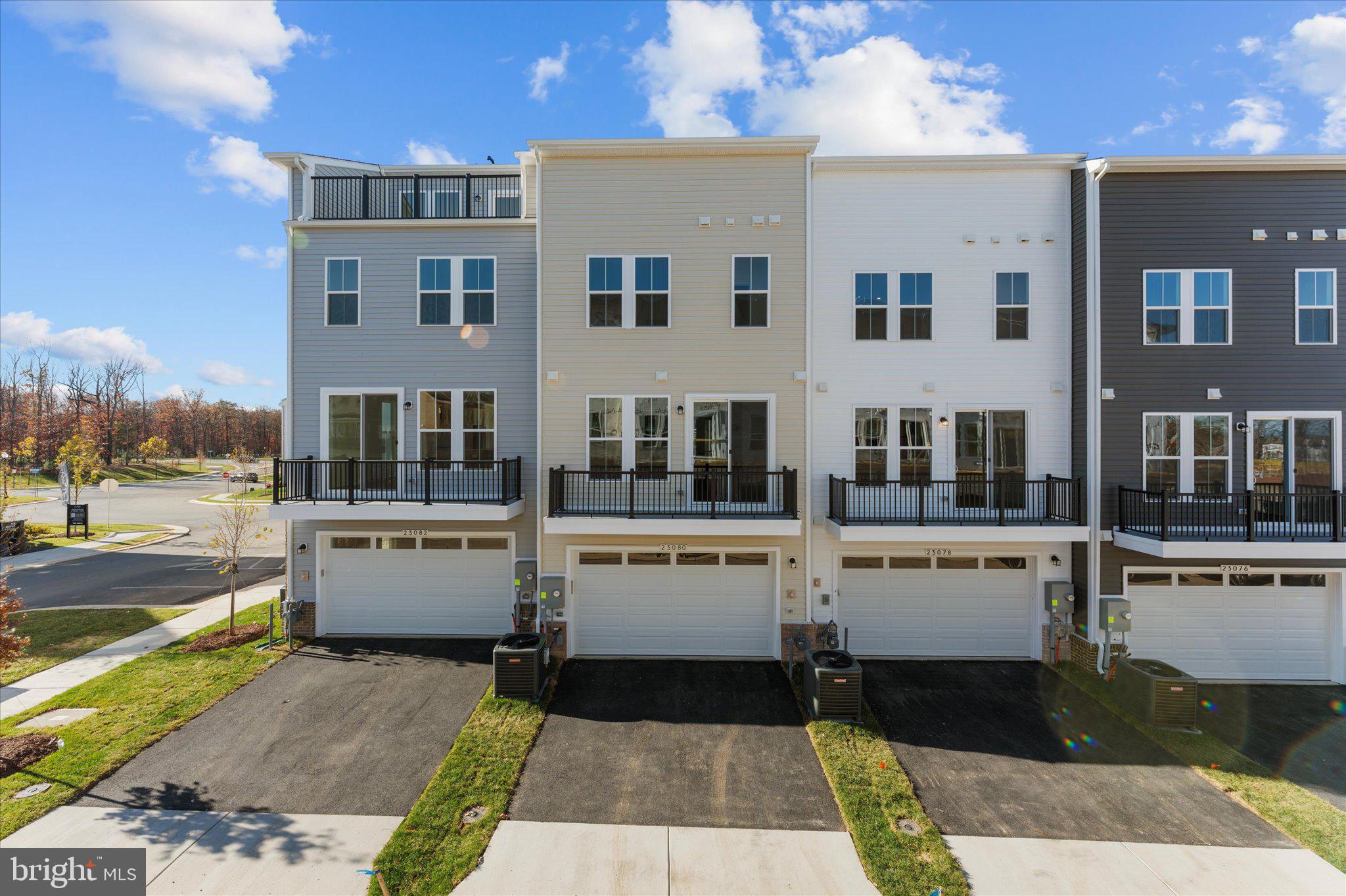 23080 Soaring Hts Terrace Ashburn, VA 20148 - Photo 38 of 44 a white building with a outdoor space