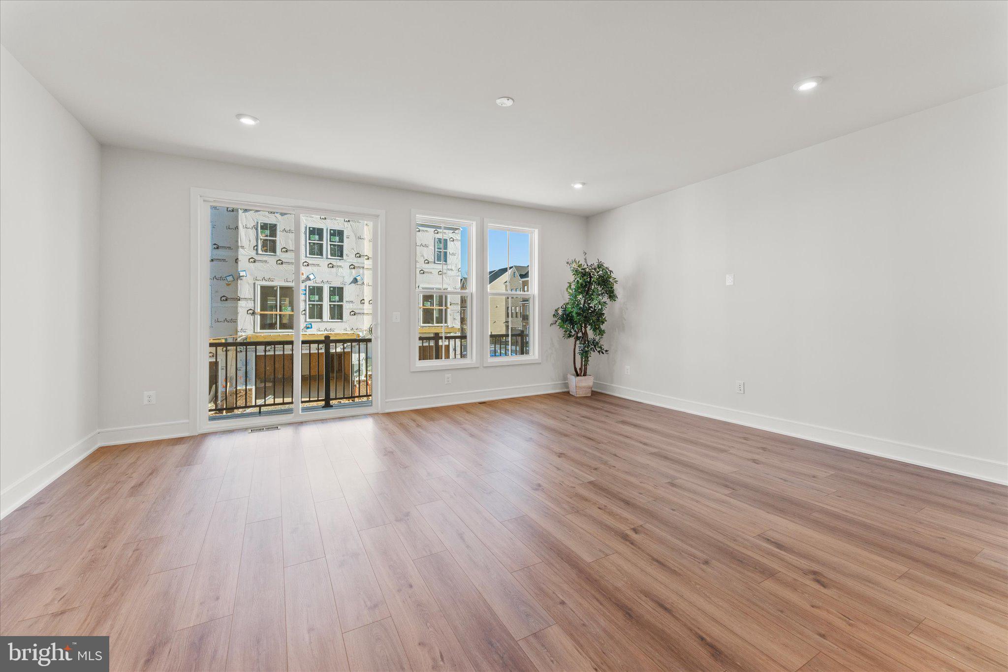 23080 Soaring Hts Terrace Ashburn, VA 20148 - Photo 9 of 44 wooden floor in an empty room with a window
