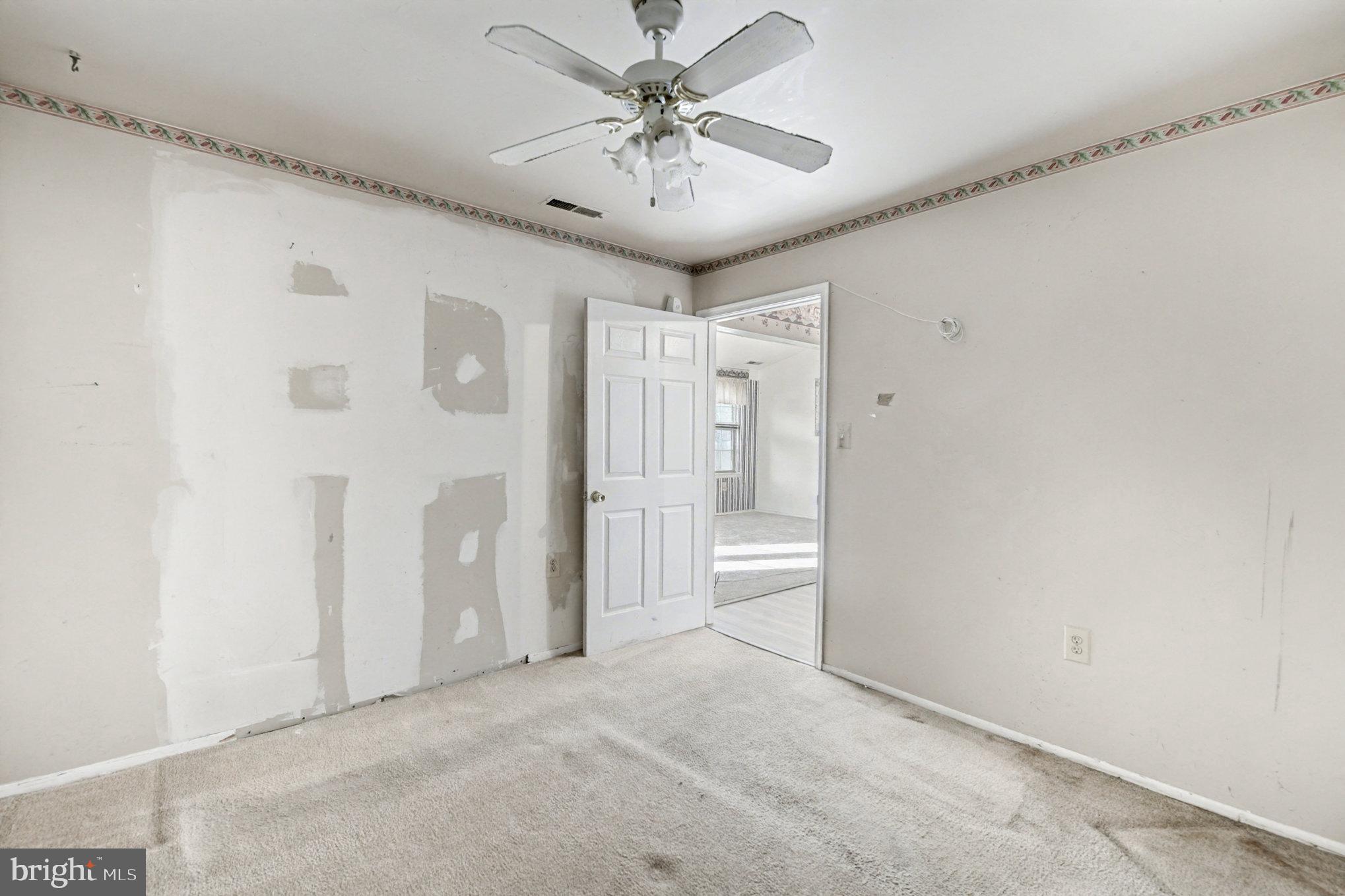 308 Laburnum Road Edgewood, MD 21040 - Photo 14 of 28 a view of a livingroom with a chandelier & a ceiling fan