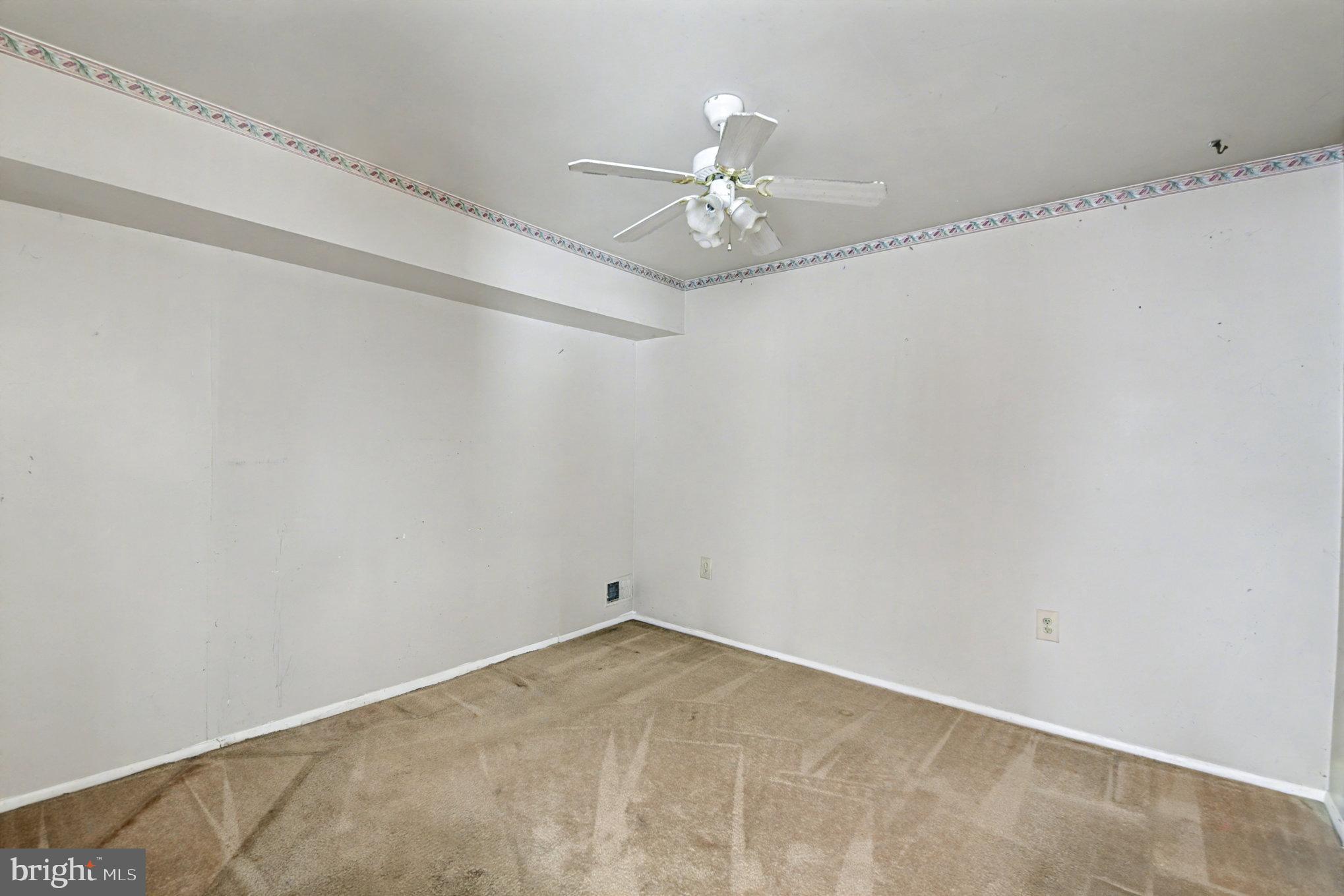 308 Laburnum Road Edgewood, MD 21040 - Photo 15 of 28 an empty room with a window and ceiling fan