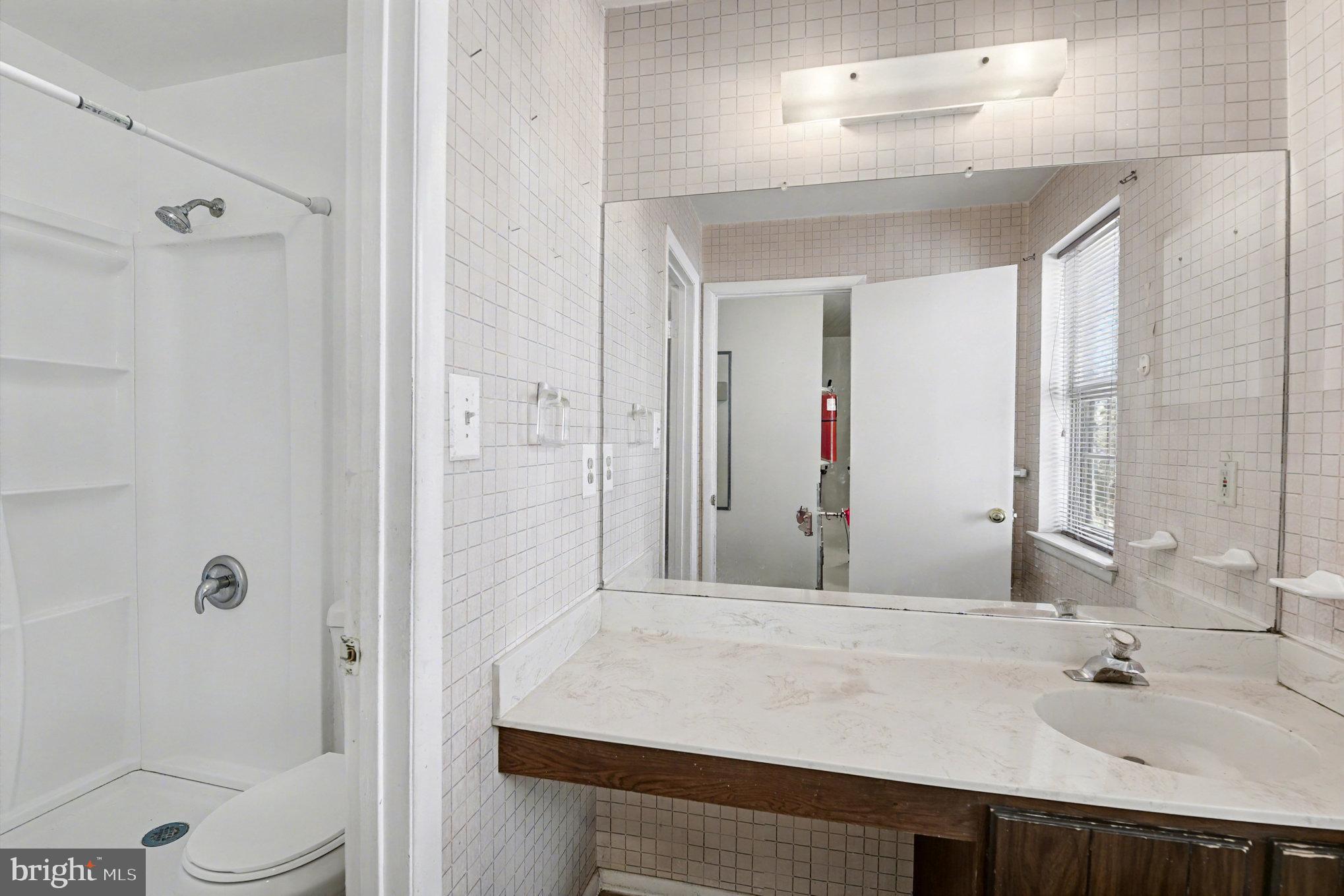 308 Laburnum Road Edgewood, MD 21040 - Photo 22 of 28 a bathroom with a sink and a mirror