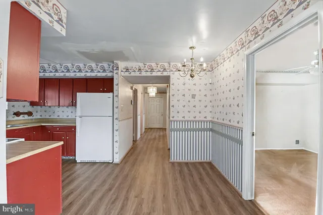 a view of a hallway view with wooden floor