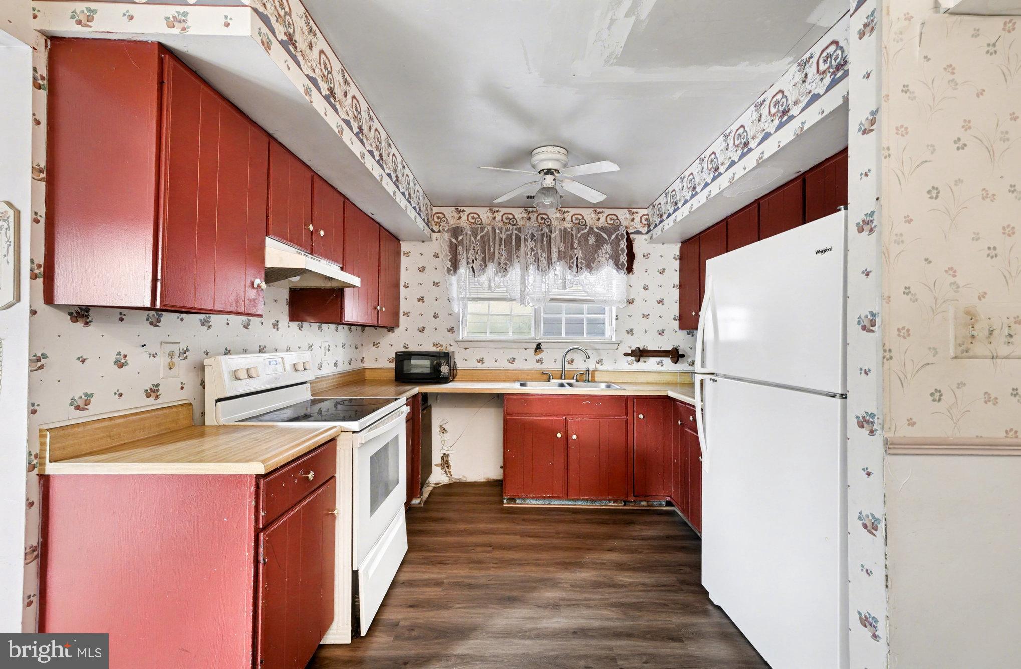 308 Laburnum Road Edgewood, MD 21040 - Photo 8 of 28 a kitchen with a refrigerator a stove top oven a sink and dishwasher