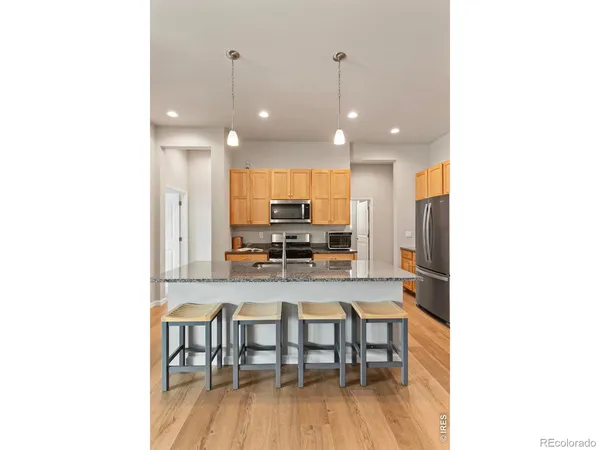 a kitchen with a table and chairs in it